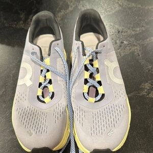 On Running Light Gray and Yellow Sneakers